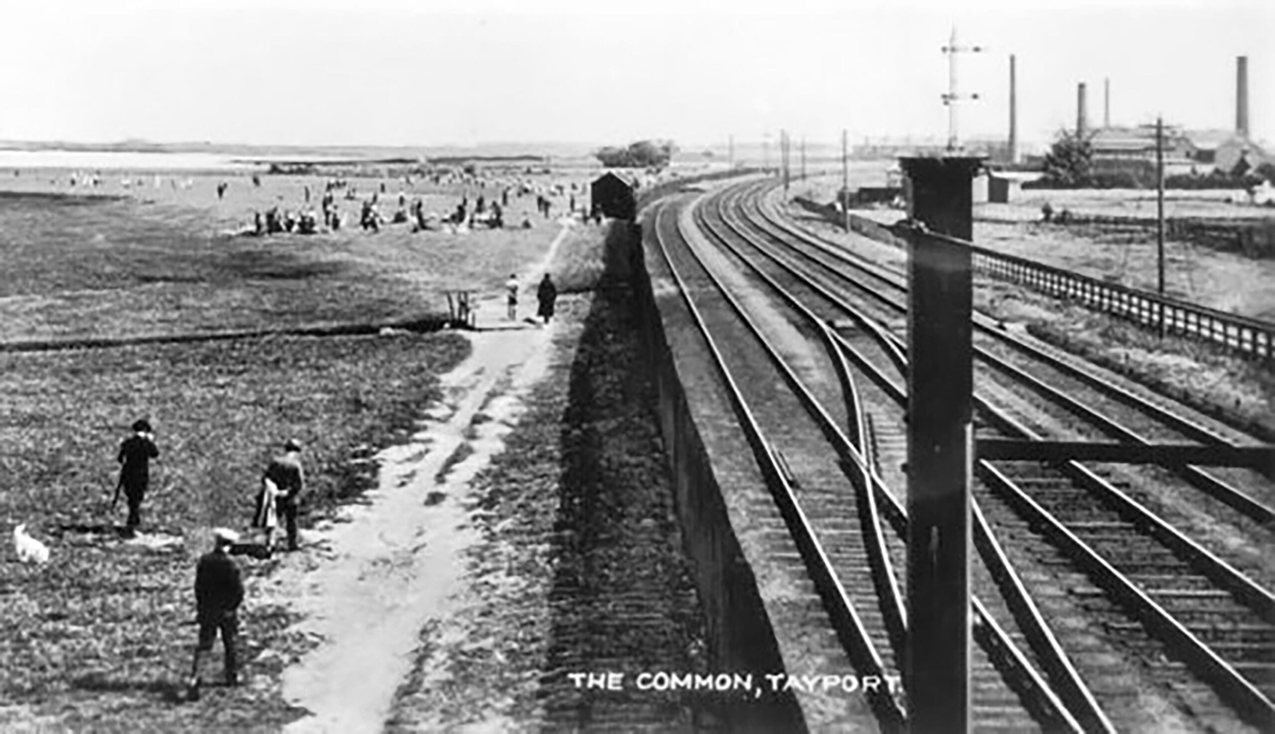 Tayport Heritage Trail - Board 20 - View from footbridge at Tayport South signal box looking towards East Common with Edinburgh rail track leading past the industrial area